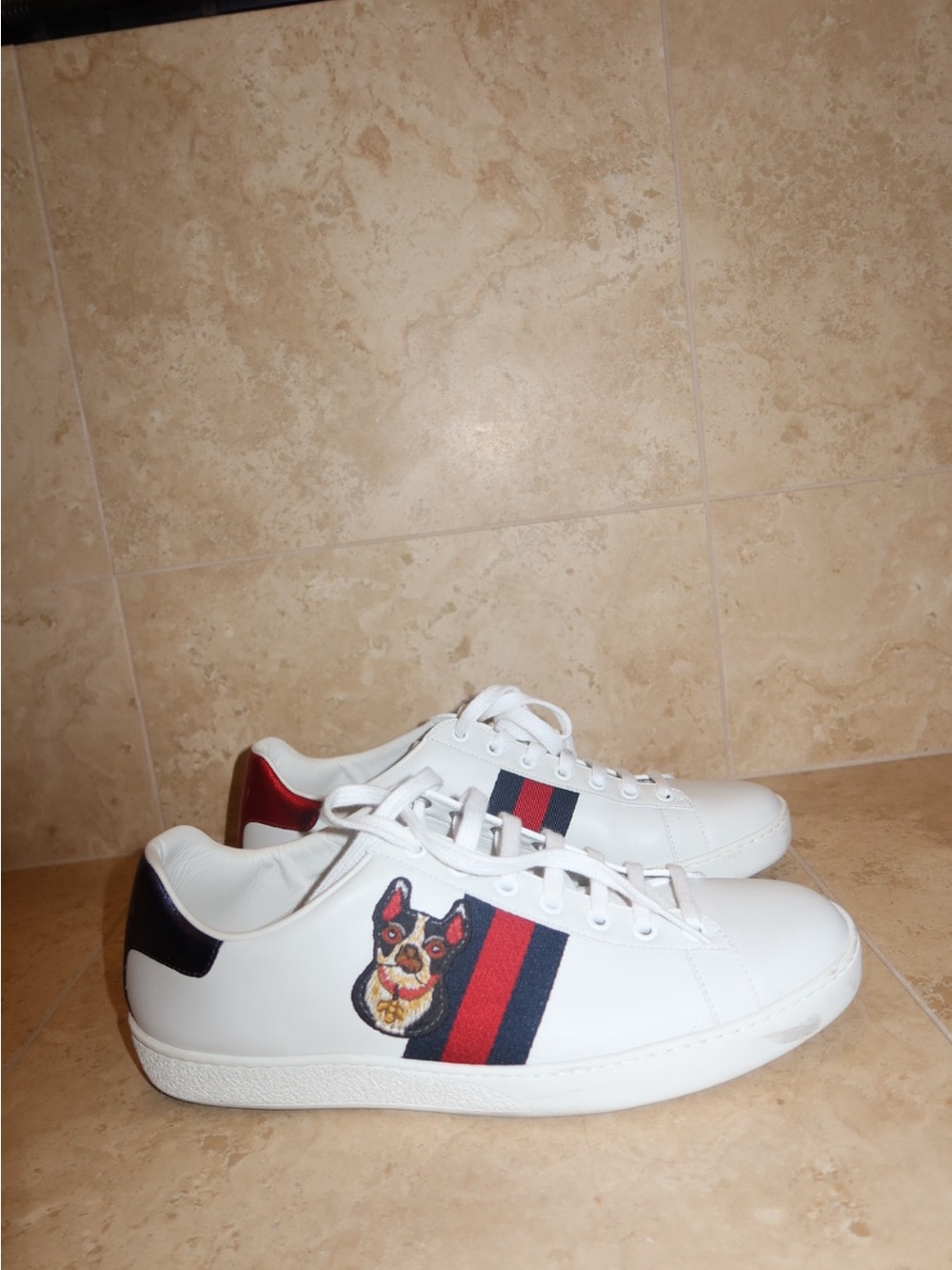 Gucci ace sneakers featuring a dog on each shoe form the year of the dog Gucci